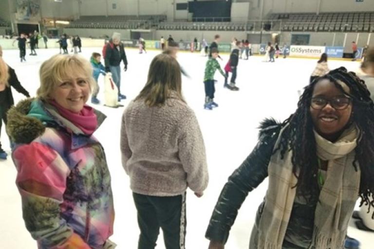 children skating on an ice rink