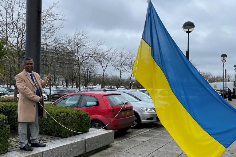 ukraine flag being hoisted at civic offices