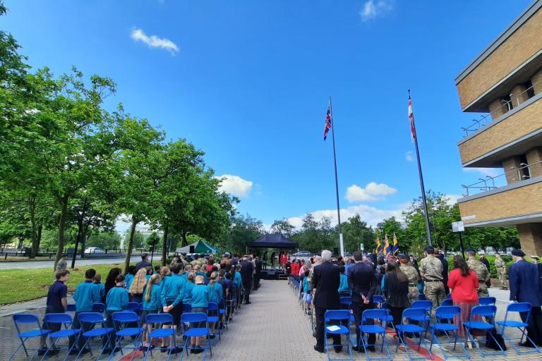 A flag raising ceremony outside Civic on Monday morning