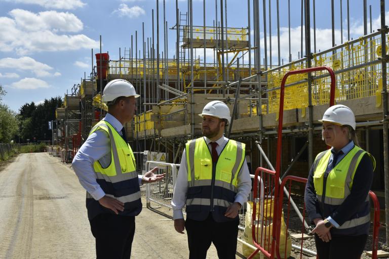 Leader of MK Council, Cllr Pete Marland at building site