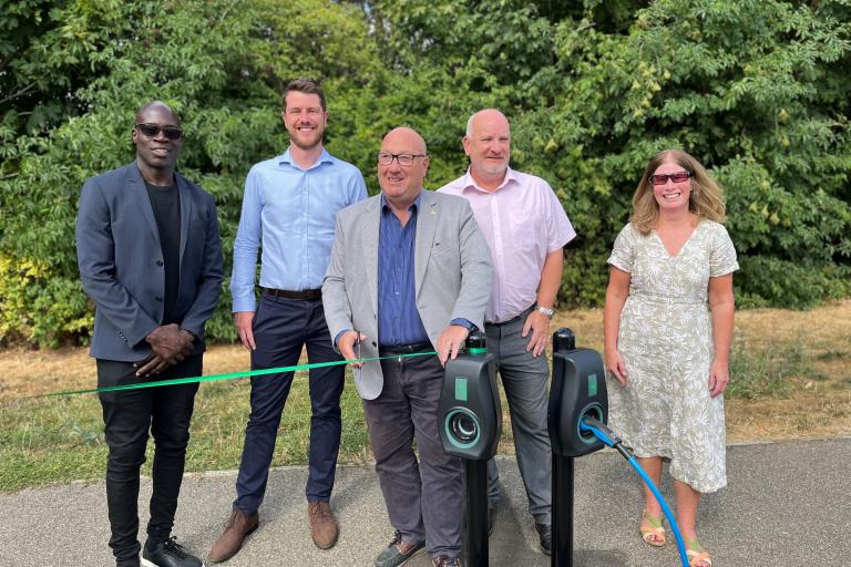 Councillors and partners unveiling 100th charge point in MK