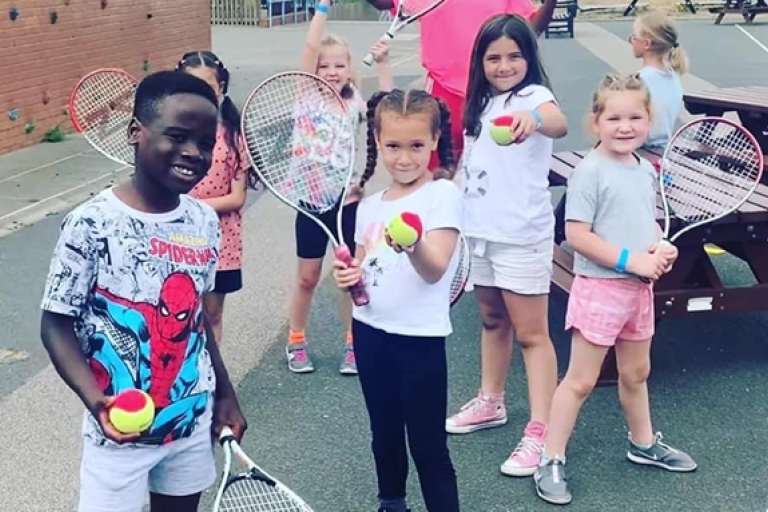 Children enjoying a tennis class at New Bradwell.
