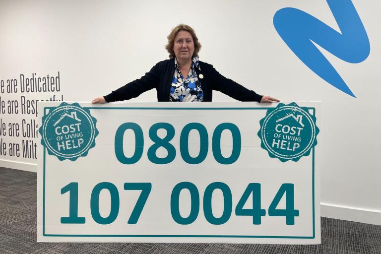 Councillor Jane Carr holding sign