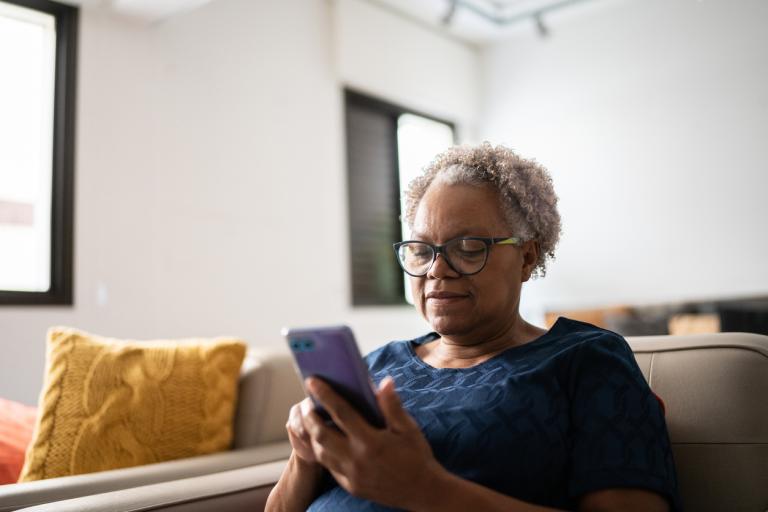 elderly woman using a mobile phone