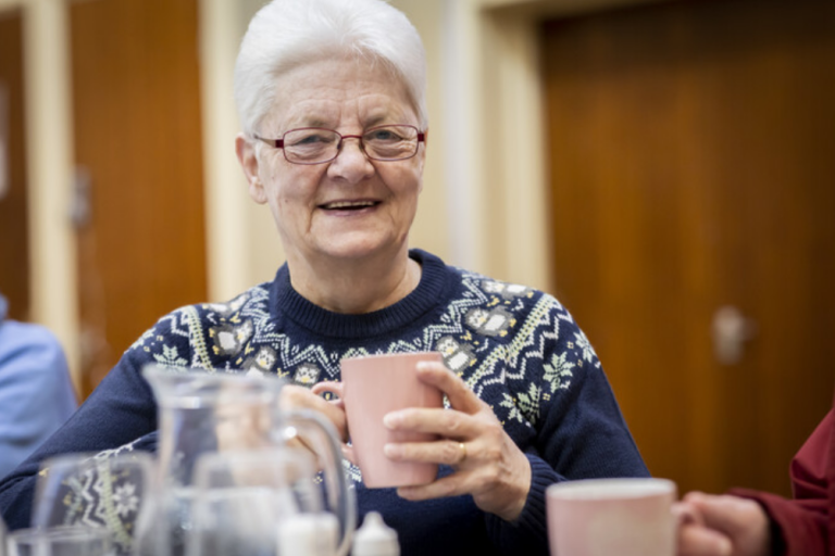 Woman in the warmth having tea