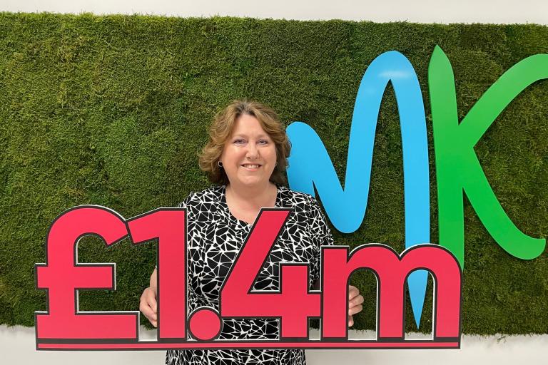 Cllr Carr holding £1.4m sign