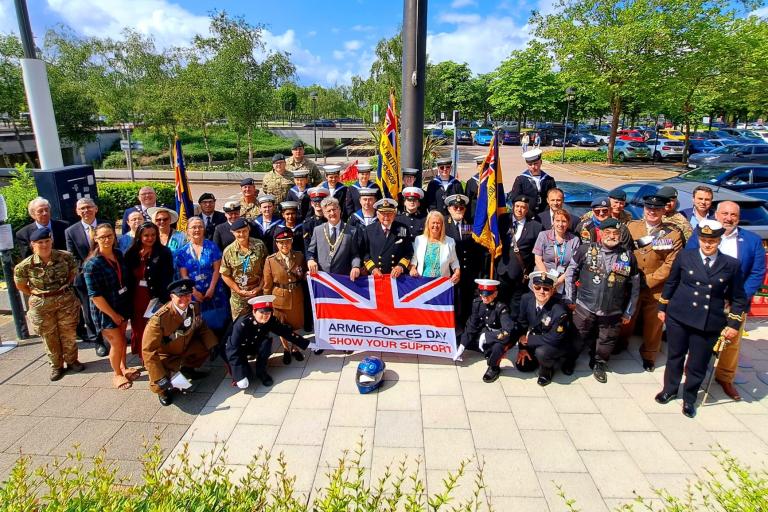 Serving members of the Armed Forces with veterans, cadets and members of the City Council