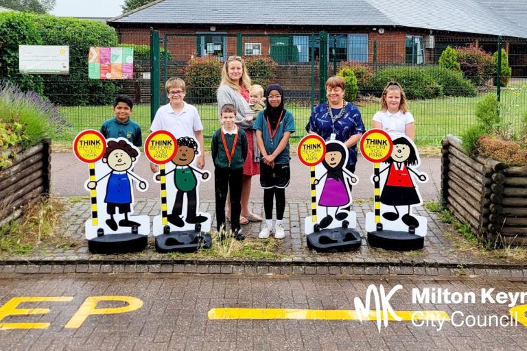 Pupils with child road safety bollards