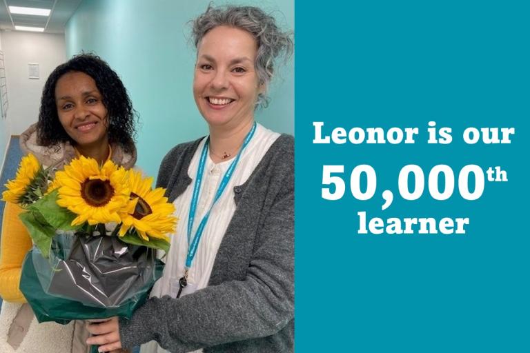Adult Learner Leonor receiving flowers