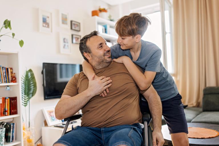 Young carer with his father