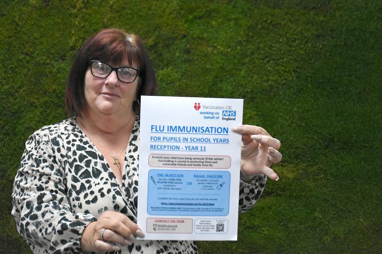 Cllr Donna Fuller holding the NHS letter to parents and carers