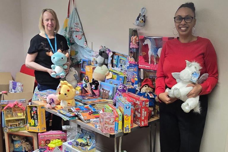 Council colleagues with hundreds of donated toys and gifts