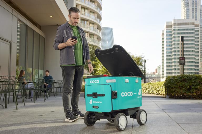 Robot with man accepting order