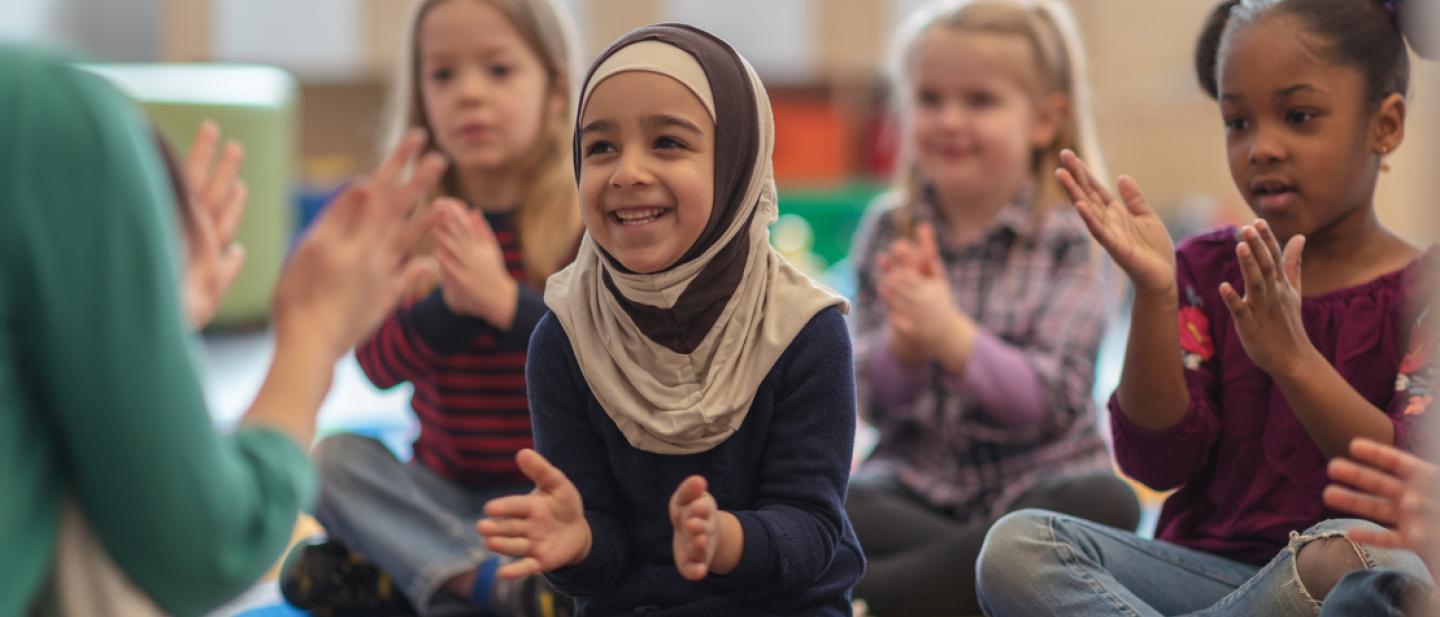 Young children enjoying songs and stories