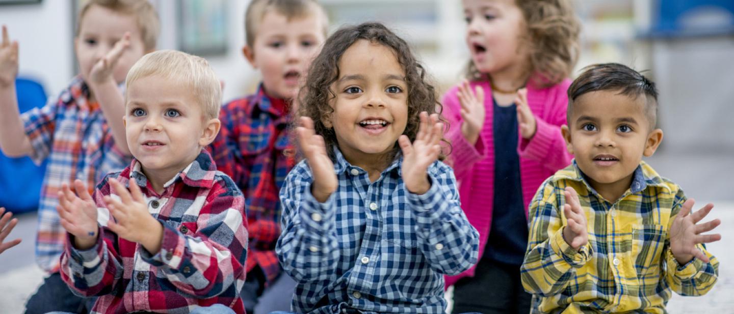 Young children enjoying songs and stories