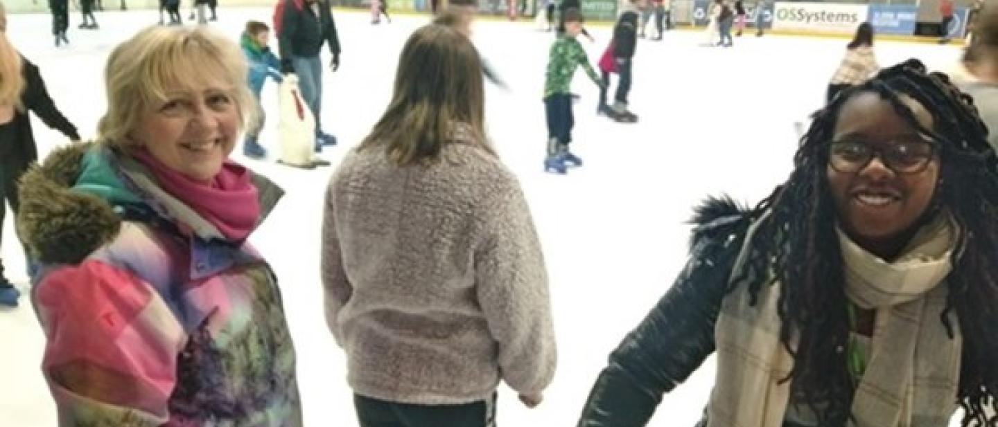 children skating on an ice rink