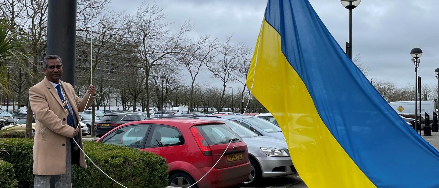 ukraine flag being hoisted at civic offices