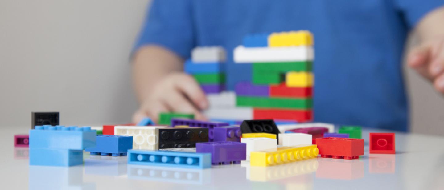Child playing with Lego bricks