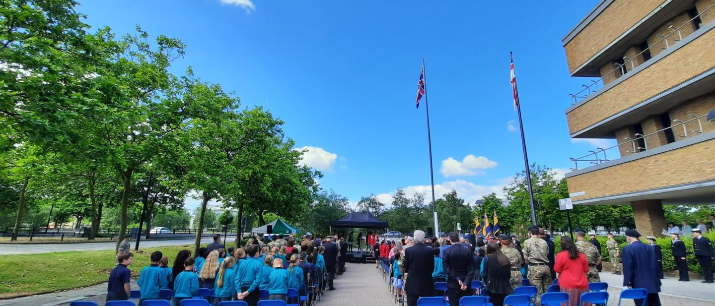 A flag raising ceremony outside Civic on Monday morning