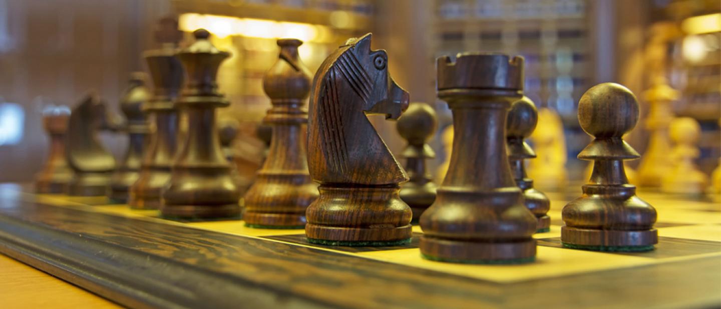 Close-up of chess pieces on a chess board