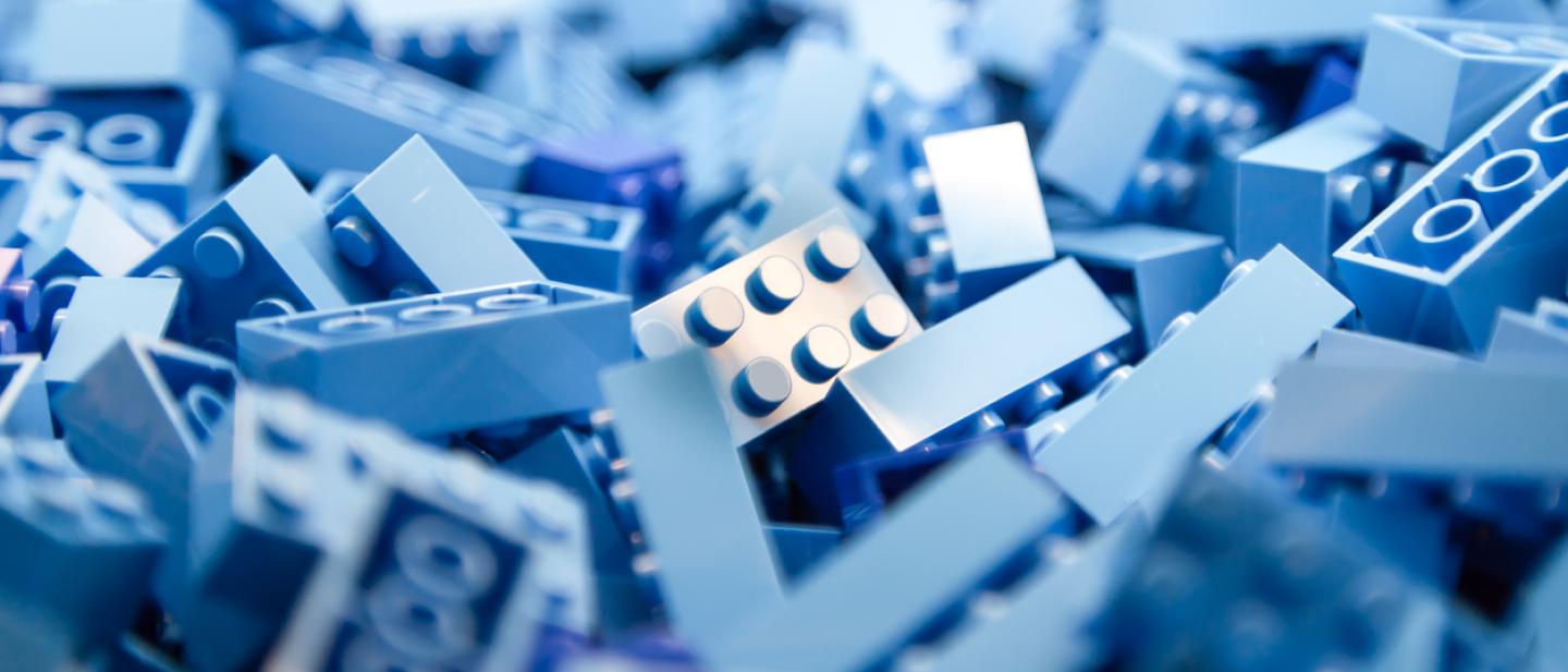 A jumble of light blue Lego bricks.