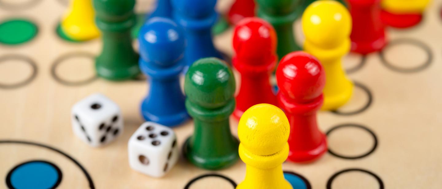 Bright board game pieces and dice.