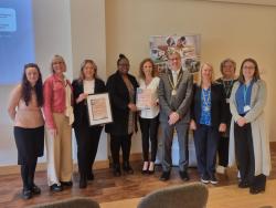 Image of winners receiving their certificate for Healthy Workplace Standards
