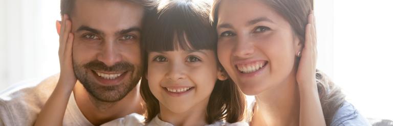 Child and Adults smiling