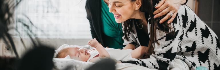 two adults and baby 