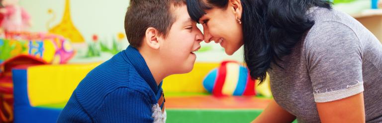 child and adult playing