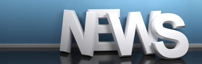 3D letters leaning against a wall, they spell out NEWS.