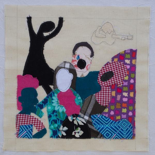 Quilt square using printed fabrics to show a group of people dancing and a guitarist in the background.