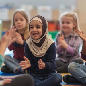 Young children enjoying songs and stories