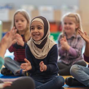 Young children enjoying songs and stories