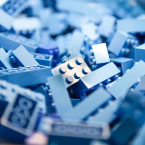 A jumble of light blue Lego bricks.
