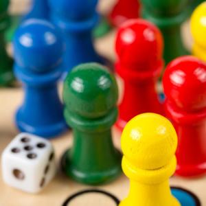 Bright board game pieces and dice.